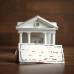 A bank check with bank behind it